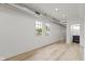A hallway is freshly painted, has hardwood floors, and bright overhead lighting at 1538 Ringgold Ave, Indianapolis, IN 46203