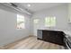 Bright kitchen with stainless steel appliances, dark cabinets, and white countertops at 1538 Ringgold Ave, Indianapolis, IN 46203