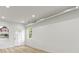 Bright living room features hardwood floors, fresh white paint and large windows at 1538 Ringgold Ave, Indianapolis, IN 46203