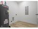 Utility room featuring a water heater, tile floors and electrical panel at 1538 Ringgold Ave, Indianapolis, IN 46203