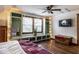 Cozy bedroom with hardwood floors, built-in storage, and a ceiling fan, creating a comfortable retreat at 1647 N Tacoma Ave, Indianapolis, IN 46218