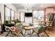 Bright living room with hardwood floors, a modern chandelier, and sliding doors leading to the outdoor space at 1647 N Tacoma Ave, Indianapolis, IN 46218