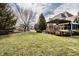 Well-maintained backyard featuring lush grass, mature trees, and a patio, perfect for outdoor enjoyment at 1805 Braeburn Dr, Carmel, IN 46032