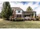 A well-maintained backyard with lush landscaping, including a patio pergola that enhances the home's outdoor appeal at 1805 Braeburn Dr, Carmel, IN 46032
