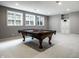 Spacious finished basement featuring a pool table, neutral walls, and ample lighting at 1805 Braeburn Dr, Carmel, IN 46032
