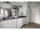 Bathroom boasting double vanity, granite countertops, decorative mirrors, and updated lighting at 1805 Braeburn Dr, Carmel, IN 46032