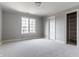 Neutral bedroom featuring a window, closet, and neutral carpet, offering a calm and serene space at 1805 Braeburn Dr, Carmel, IN 46032