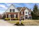 Beautiful brick home with a manicured lawn and a classic architectural style at 1805 Braeburn Dr, Carmel, IN 46032