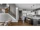 Modern kitchen with a spacious island, stainless steel appliances, and stylish pendant lighting at 1805 Braeburn Dr, Carmel, IN 46032