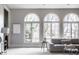 Inviting living room with abundant natural light, a comfortable sofa, and neutral decor at 1805 Braeburn Dr, Carmel, IN 46032