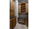 Home office with wooden cabinetry, dark countertop, and built in desk space at 1805 Braeburn Dr, Carmel, IN 46032