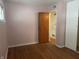 Bedroom with hardwood flooring, offers a simple yet inviting space with room for customization at 1843 Bauer Rd, Indianapolis, IN 46218