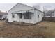 Cozy one story home with white siding and green awning detail over porch at 1843 Bauer Rd, Indianapolis, IN 46218