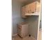 Compact kitchen area featuring wooden cabinets and standard appliances, perfect for efficient meal preparation at 1843 Bauer Rd, Indianapolis, IN 46218