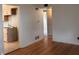 Open living space with hardwood floors, neutral paint, and view to kitchen at 1843 Bauer Rd, Indianapolis, IN 46218