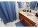 Clean bathroom with a wooden vanity, single sink, a shower with curtains, and neutral paint at 1939 Crystal Bay E Dr, Plainfield, IN 46168