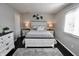 A beautifully designed bedroom with a plush rug, a stylish bed, and soft, ambient lighting at 1939 Crystal Bay E Dr, Plainfield, IN 46168