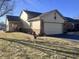 Charming home with a two-car garage, a well-manicured lawn, and a quaint front porch at 1939 Crystal Bay E Dr, Plainfield, IN 46168