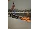 A cozy view of a waterfront home with a charming snow-covered dock decorated with festive holiday lights at 1939 Crystal Bay E Dr, Plainfield, IN 46168