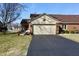 Charming home with a well-manicured lawn and paved driveway leading to a two-car garage at 1939 Crystal Bay E Dr, Plainfield, IN 46168