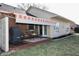 Backyard view of covered patio with comfortable chairs and retractable awning for relaxation at 1939 Crystal Bay E Dr, Plainfield, IN 46168