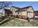 Charming single-story home with a landscaped front yard, red door and attached two car garage at 1939 Crystal Bay E Dr, Plainfield, IN 46168