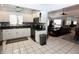 Eat-in kitchen with stainless steel appliances and an open layout to the living area at 1939 Crystal Bay E Dr, Plainfield, IN 46168