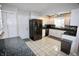 Bright kitchen features stainless steel appliances, white cabinetry, and checkered backsplash at 1939 Crystal Bay E Dr, Plainfield, IN 46168