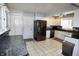 Bright kitchen with white cabinetry, stainless steel appliances, and granite countertops at 1939 Crystal Bay E Dr, Plainfield, IN 46168