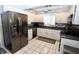 Updated kitchen with stainless steel appliances, white cabinets, and granite countertops at 1939 Crystal Bay E Dr, Plainfield, IN 46168
