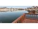 Scenic lake view with a wooden deck and railing, perfect for enjoying the peaceful waterfront setting at 1939 Crystal Bay E Dr, Plainfield, IN 46168