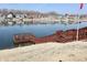 Picturesque waterfront view of houses lining the community lake and the wooden dock area at 1939 Crystal Bay E Dr, Plainfield, IN 46168