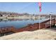 Waterfront view featuring a community lake, residences and a wooden dock area with steps at 1939 Crystal Bay E Dr, Plainfield, IN 46168