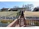 Elevated view of the house from the waterfront and dock access point down a hill from the residence at 1939 Crystal Bay E Dr, Plainfield, IN 46168