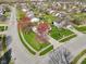 Charming home on a corner lot featuring a well-manicured lawn and mature trees at 2020 Cross Willow Ln, Indianapolis, IN 46239