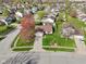 Aerial view of a well-maintained home with lush green lawn and driveway at 2020 Cross Willow Ln, Indianapolis, IN 46239