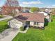Aerial view of house showcasing its landscaping, and brick/siding exterior at 2020 Cross Willow Ln, Indianapolis, IN 46239
