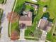 Aerial view of the backyard with patio, landscaped garden, and a shed at 2020 Cross Willow Ln, Indianapolis, IN 46239
