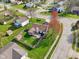Aerial view of landscaped backyard with screened porch, patio, and fenced yard at 2020 Cross Willow Ln, Indianapolis, IN 46239