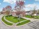 Corner lot home aerial showcasing green lawns and tree-lined street at 2020 Cross Willow Ln, Indianapolis, IN 46239