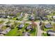 Aerial view of home with manicured lawn and fenced backyard with patio area at 2020 Cross Willow Ln, Indianapolis, IN 46239