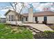 Backyard featuring a patio, sunroom, and landscaped yard at 2020 Cross Willow Ln, Indianapolis, IN 46239