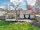 Well-maintained backyard featuring a patio, garden beds, mature trees, and privacy fencing at 2020 Cross Willow Ln, Indianapolis, IN 46239