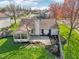 Backyard featuring a stone patio, manicured lawn, and privacy fence at 2020 Cross Willow Ln, Indianapolis, IN 46239