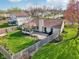 Spacious backyard with patio, lush lawn, garden beds, and a privacy fence at 2020 Cross Willow Ln, Indianapolis, IN 46239