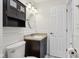Renovated bathroom with white vanity and modern fixtures at 2020 Cross Willow Ln, Indianapolis, IN 46239