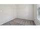 Bedroom showcasing neutral carpet, freshly painted white walls, and a window at 2020 Cross Willow Ln, Indianapolis, IN 46239