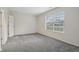 Bedroom features neutral carpet, a large window and plenty of natural light at 2020 Cross Willow Ln, Indianapolis, IN 46239