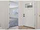Welcoming entryway with a white front door and sidelight window at 2020 Cross Willow Ln, Indianapolis, IN 46239