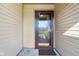 Welcoming front door with a full glass panel, set against neutral siding, and featuring a clean, tidy entrance area at 2020 Cross Willow Ln, Indianapolis, IN 46239